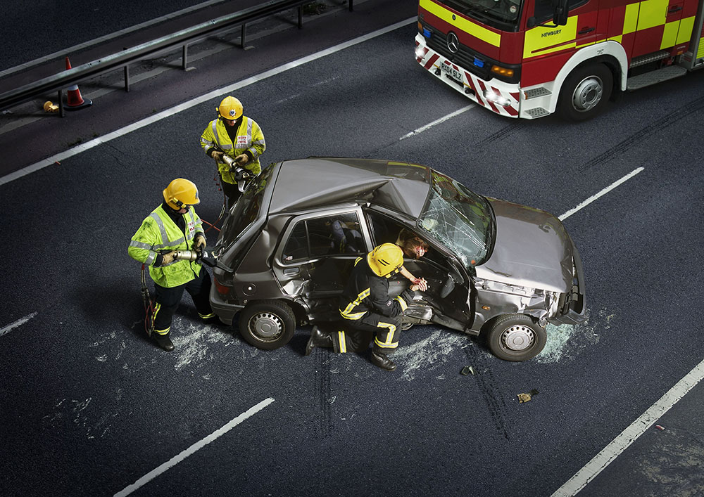 The image Long Delay was created using actors and rescue workers and re-enacts a real road incident as described by those involved. The title refers to the way in which many of us are informed of such events on car radios or social media. A long delay can be inconvenient for us – but life or death to the people involved.