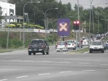 Cross sign on road